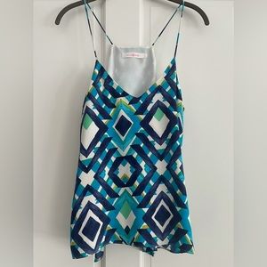 Beautiful camisole/tank top looks great with denim and white pants.